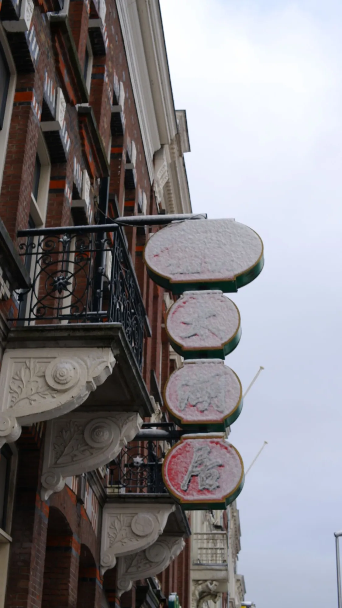 Chinese restuarant sign covered in snow