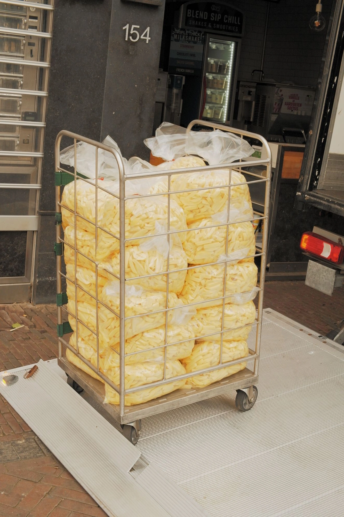 2026-05-31 - xt35 - color - NL - Utrecht - Crate of unfried fries in bags