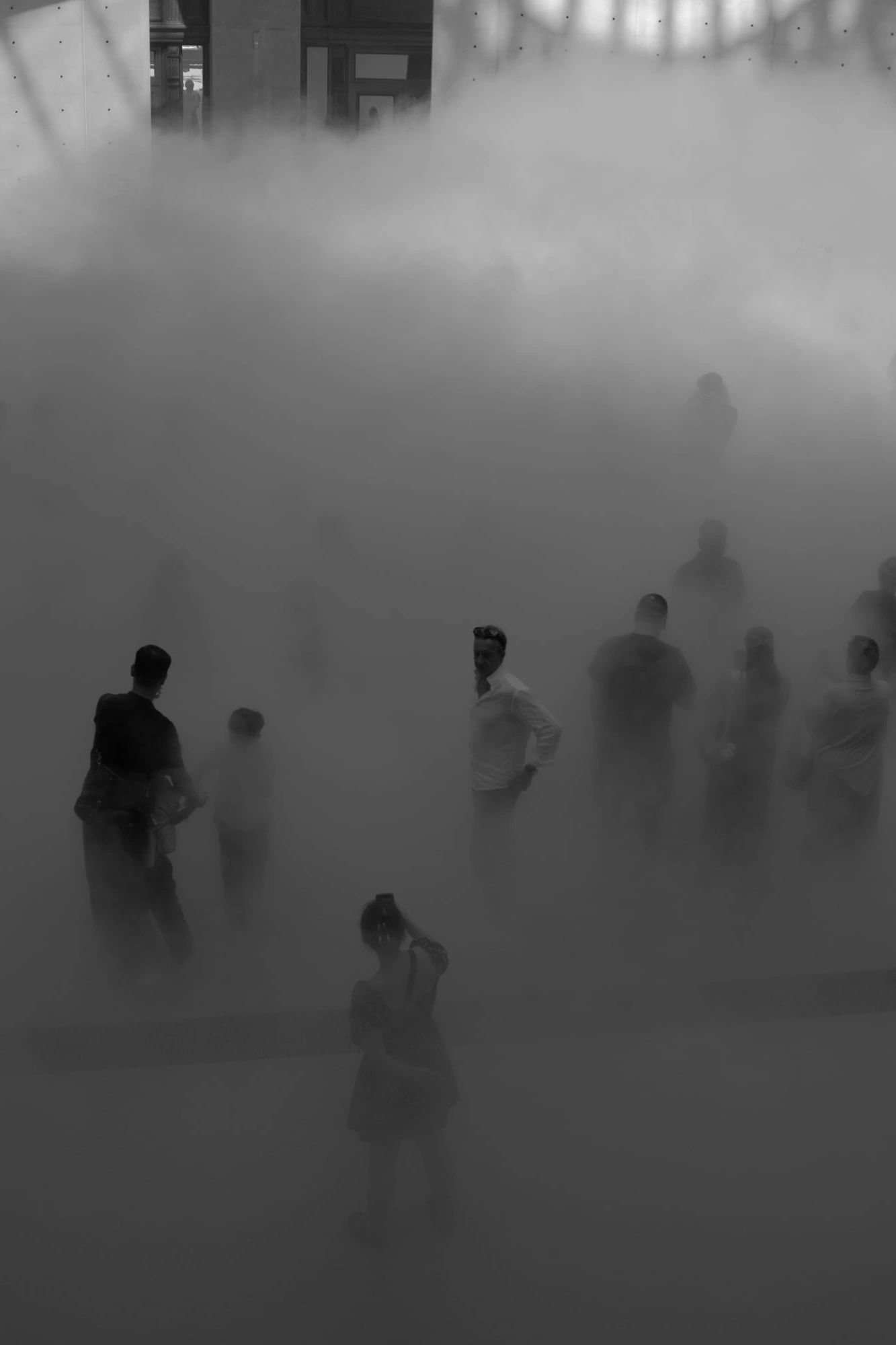 Person taking pictures of others in Cloud