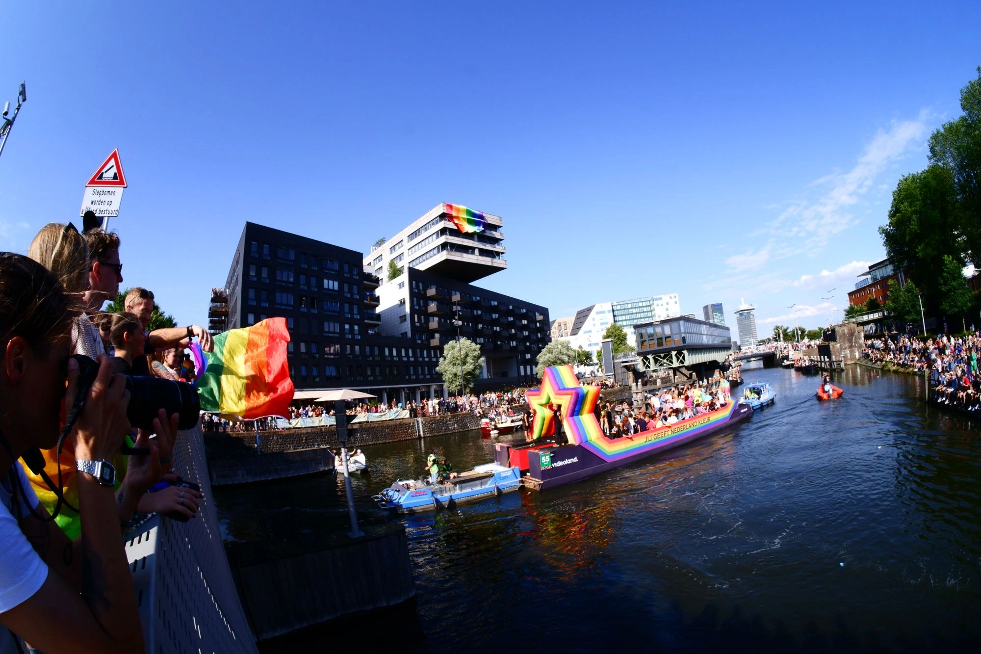 2026-08-01 - xt7.5 - color - NL - Amsterdam - People waving pride flags in front of canal