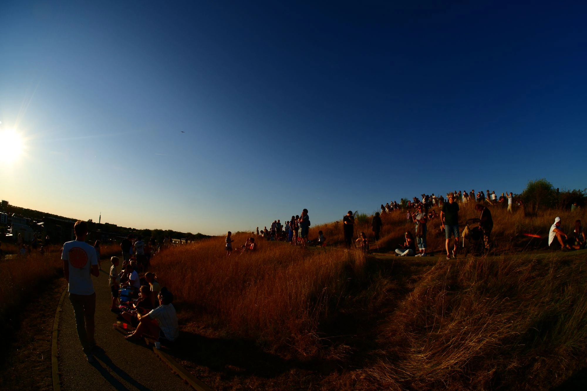 People standing around hill