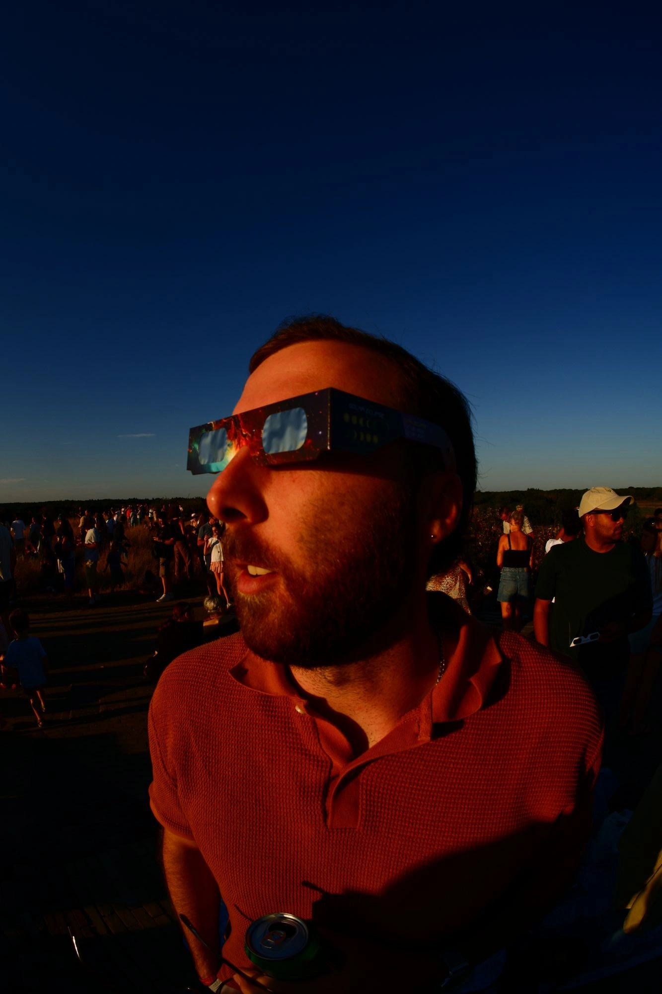 Person wearing eclipse glasses