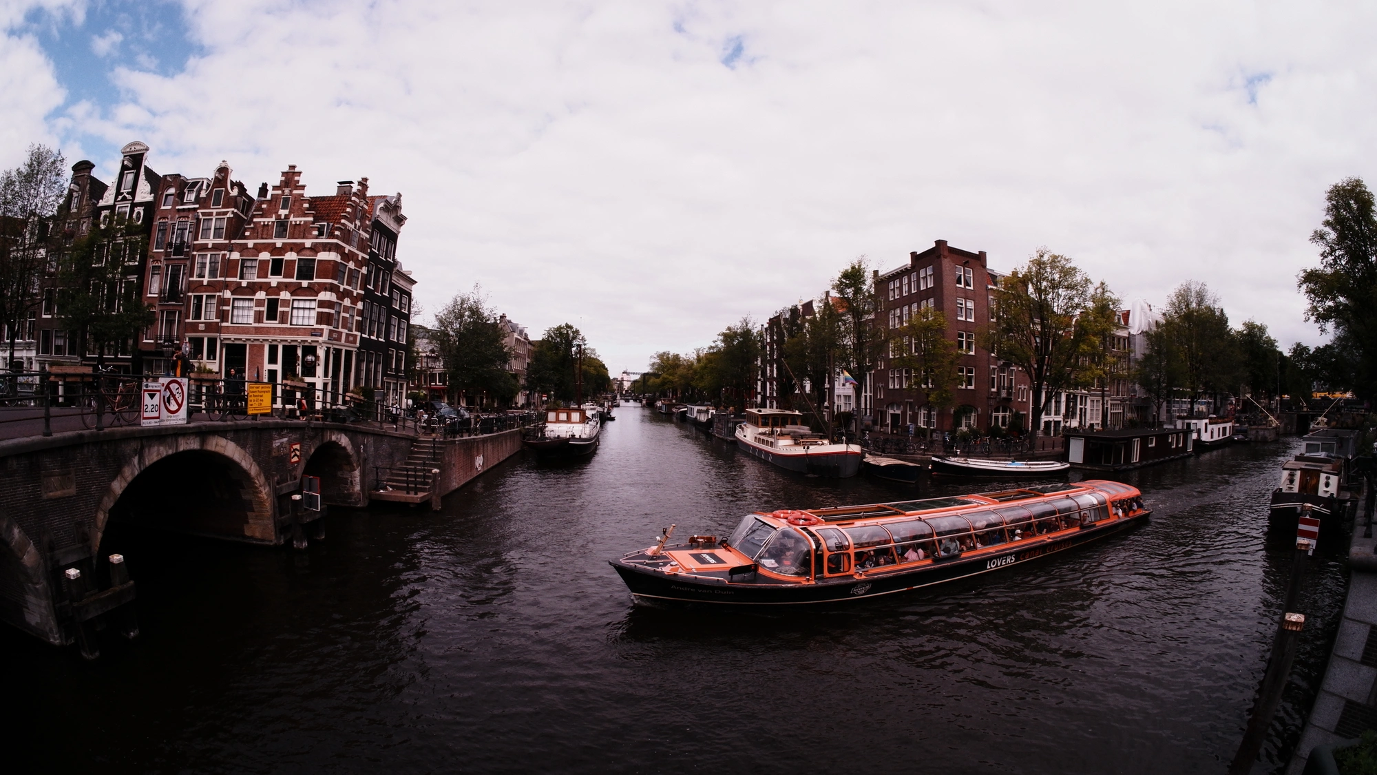 Tourist boat passing through canal