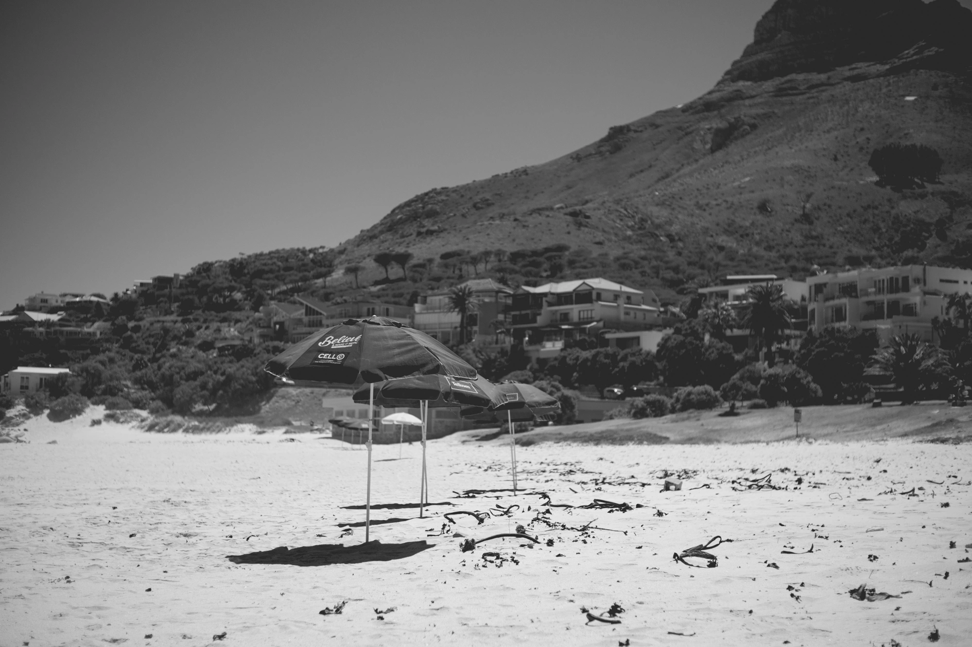 2022-02-16 - xt35 - bw - ZA - Cape Town - Umbrellas on beach