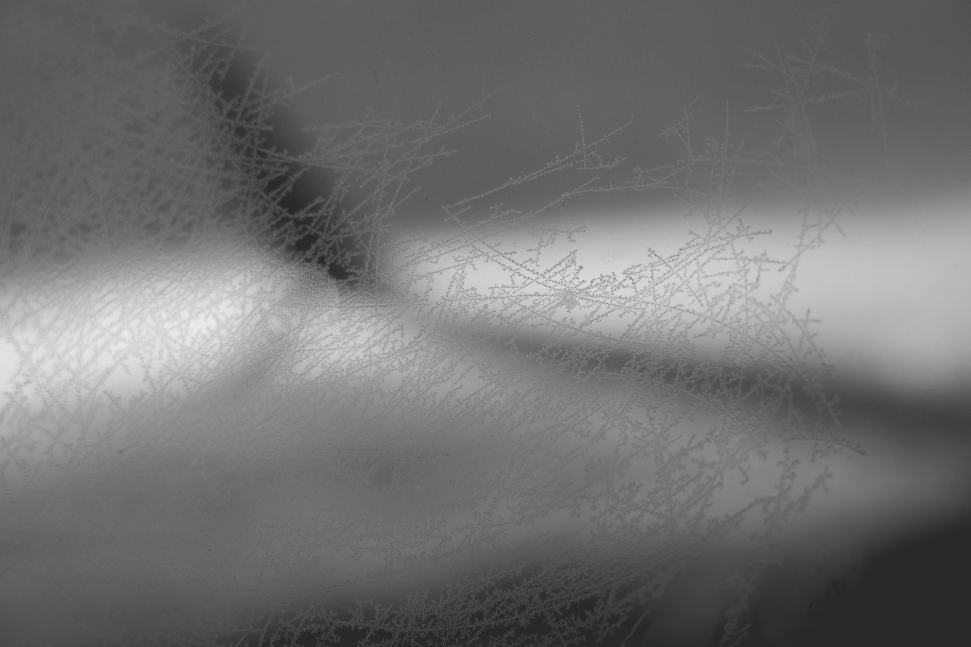 2022-02-18 - xt35 - bw - ZA - Cape Town - Ice on airplane window