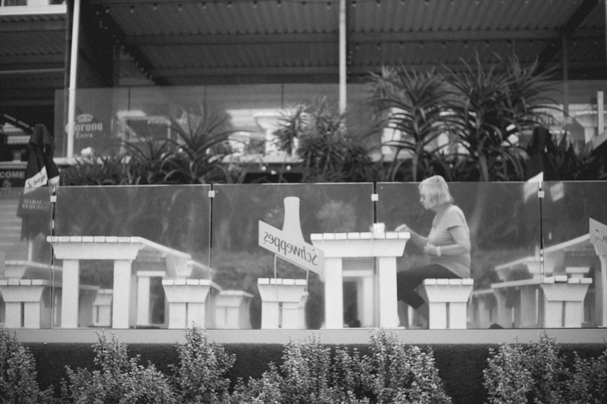 2022-09-18 - xt35 - bw - ZA - Durban - Person eating at restuarant