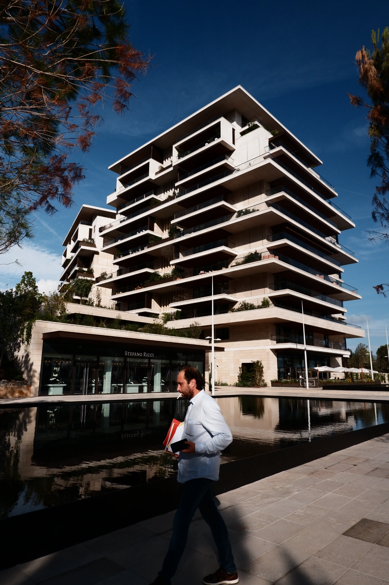 2025-09-08 - xt15-45 - color - MC - Monte Carlo - Person walking in front of building
