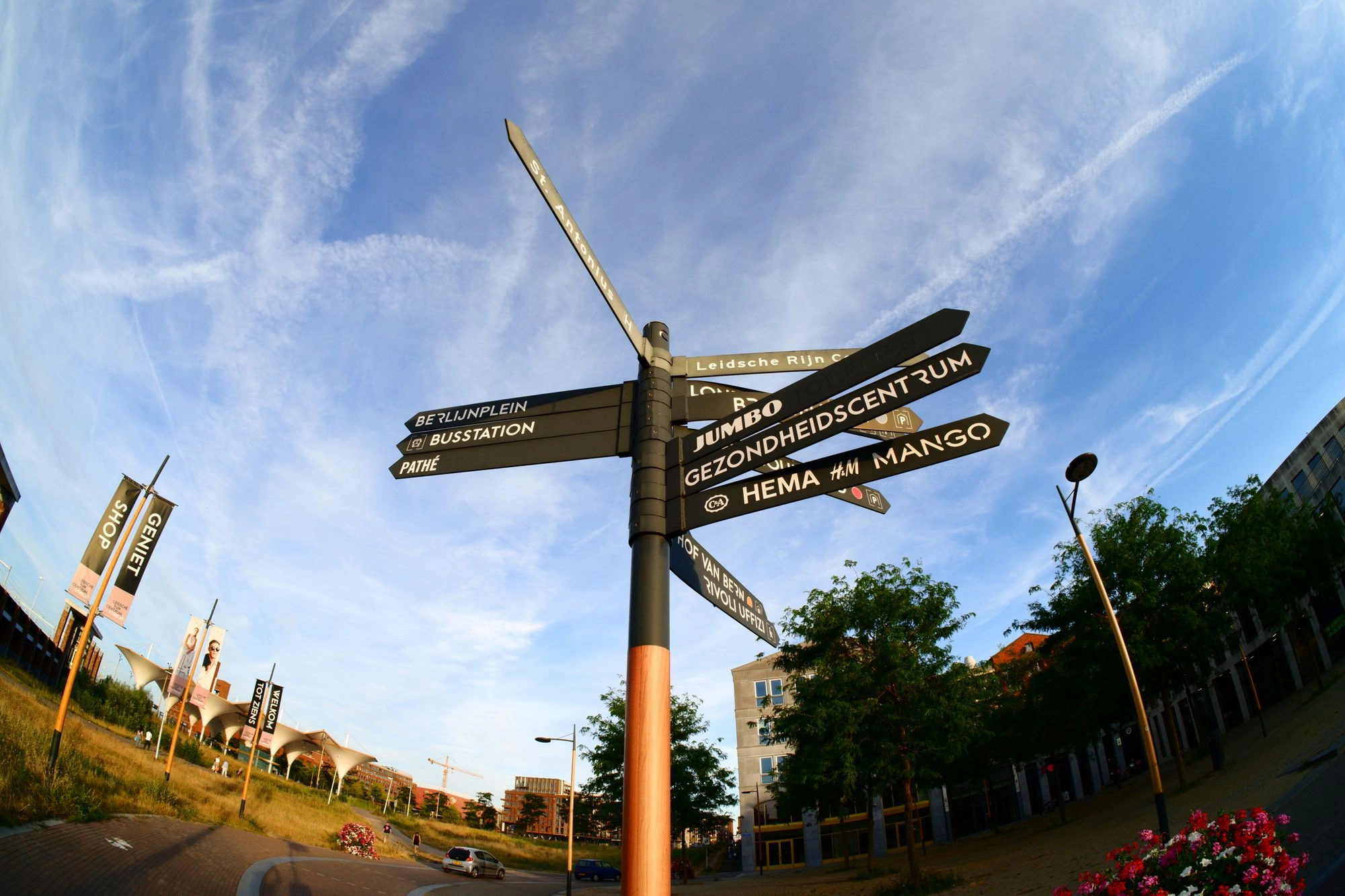 Street sign pointing at nearby places