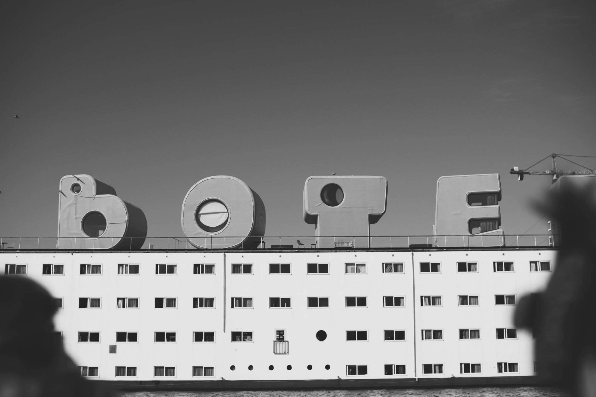 2024-09-27 - xt35 - bw - NL - Amsterdam - BOTEL sign on top of ship