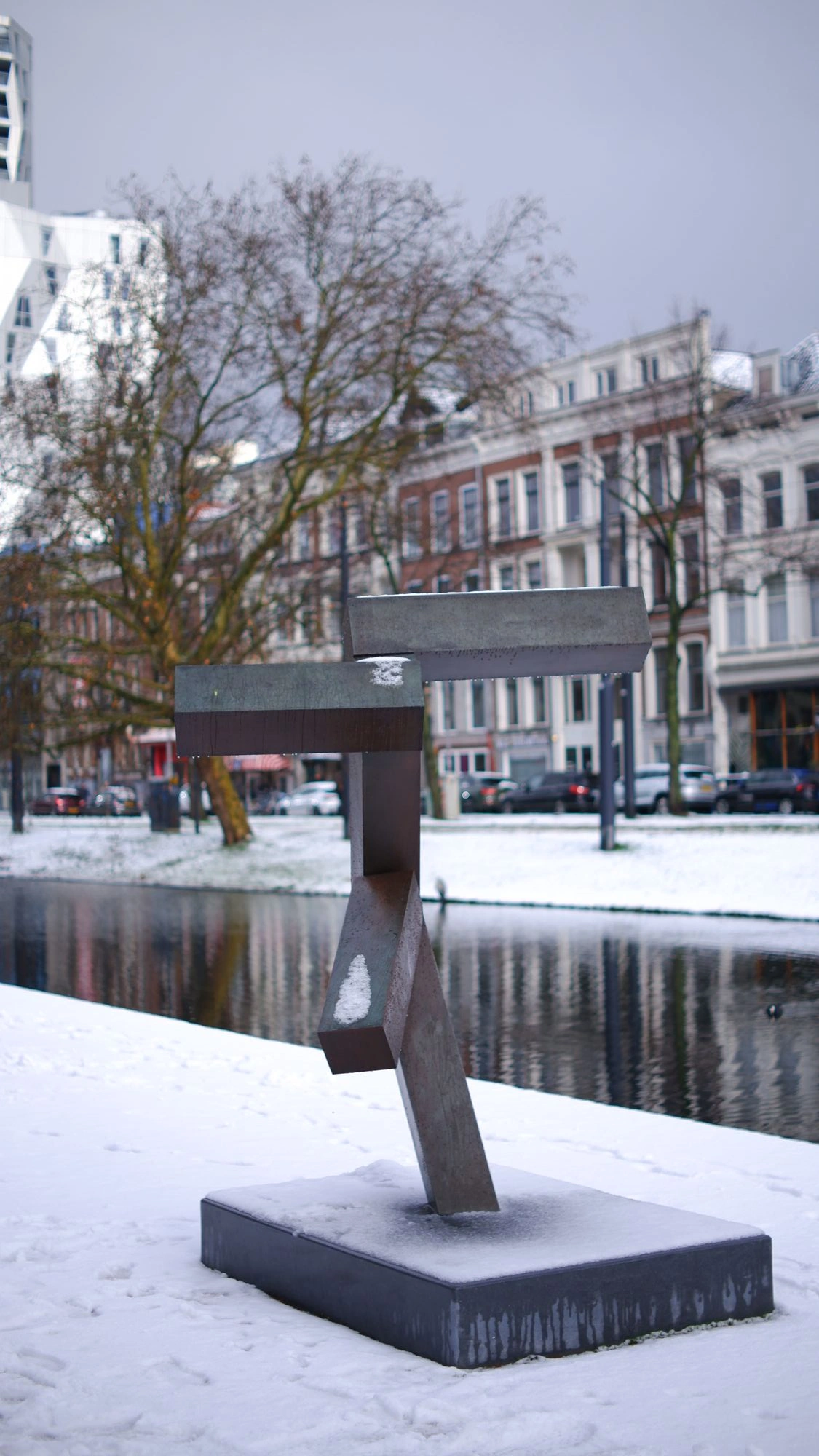 Sculpture beside canal in the snow.J