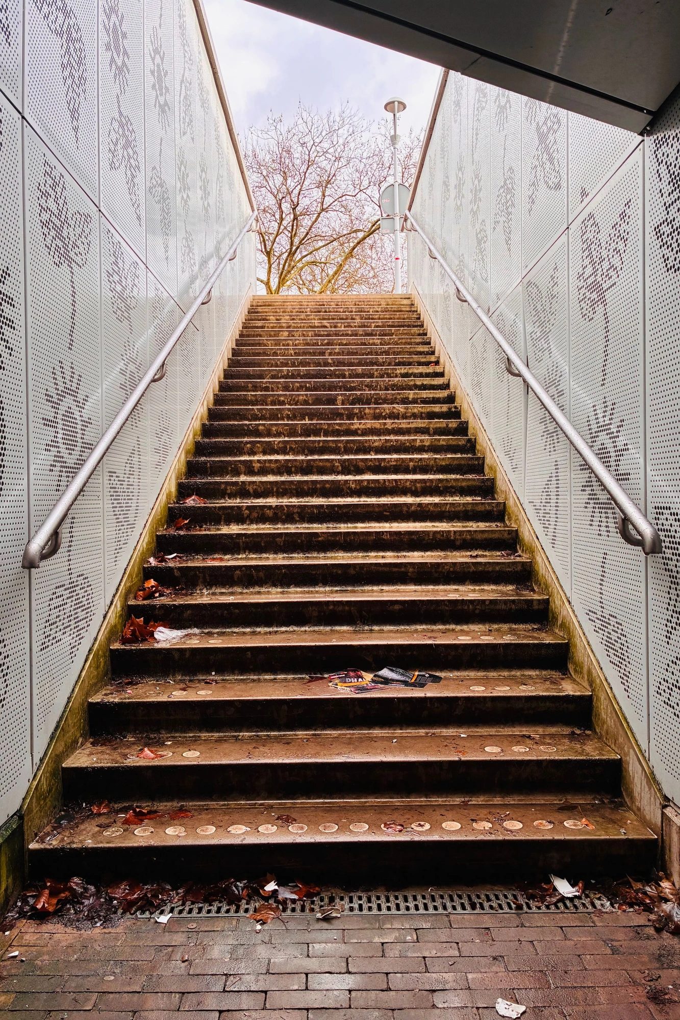 Staircase leading up towards warm light.j