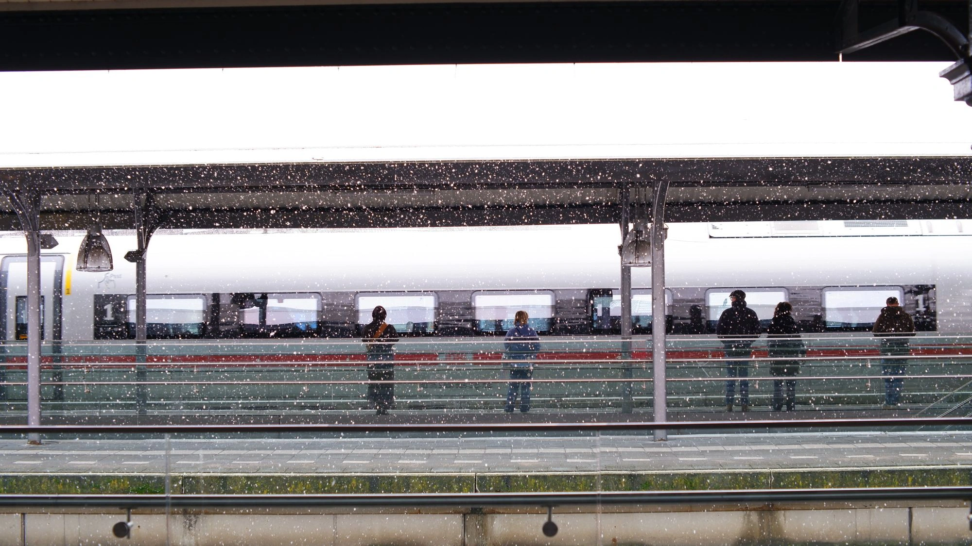 Train station with falling snow.J