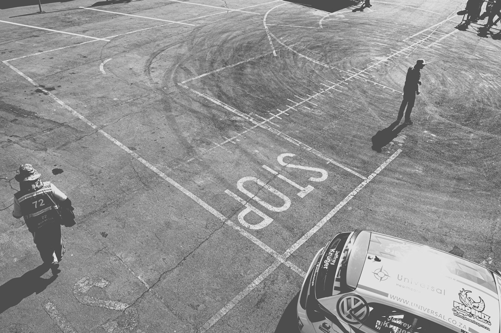 2019-07-27 - Zwartkops Raceway - Man surrounded by tire skidmarks.j