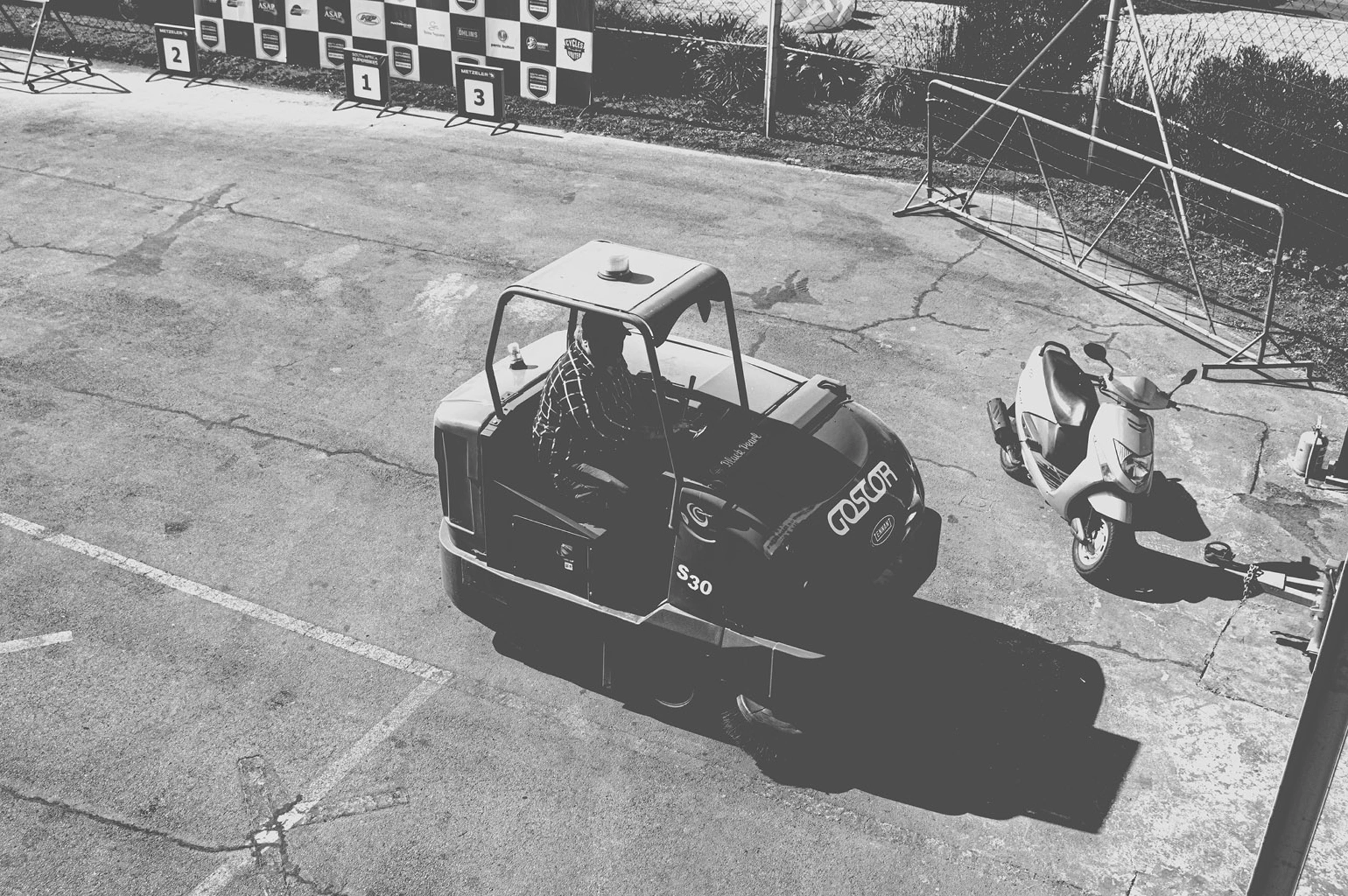 2019-07-27 - Zwartkops Raceway - Track clearing machine beside scooter.j