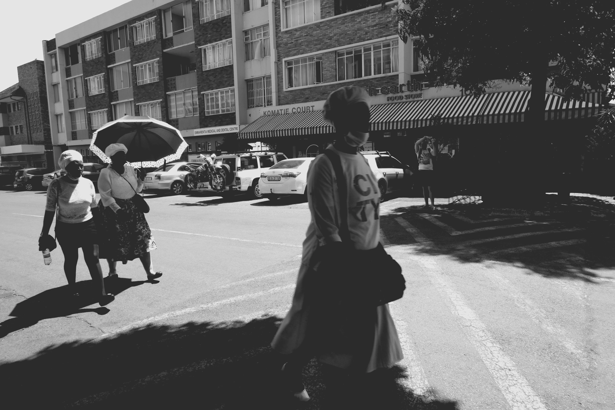 2021-11-07 - Emmerentia, Johannesburg - Women walking across the road.j